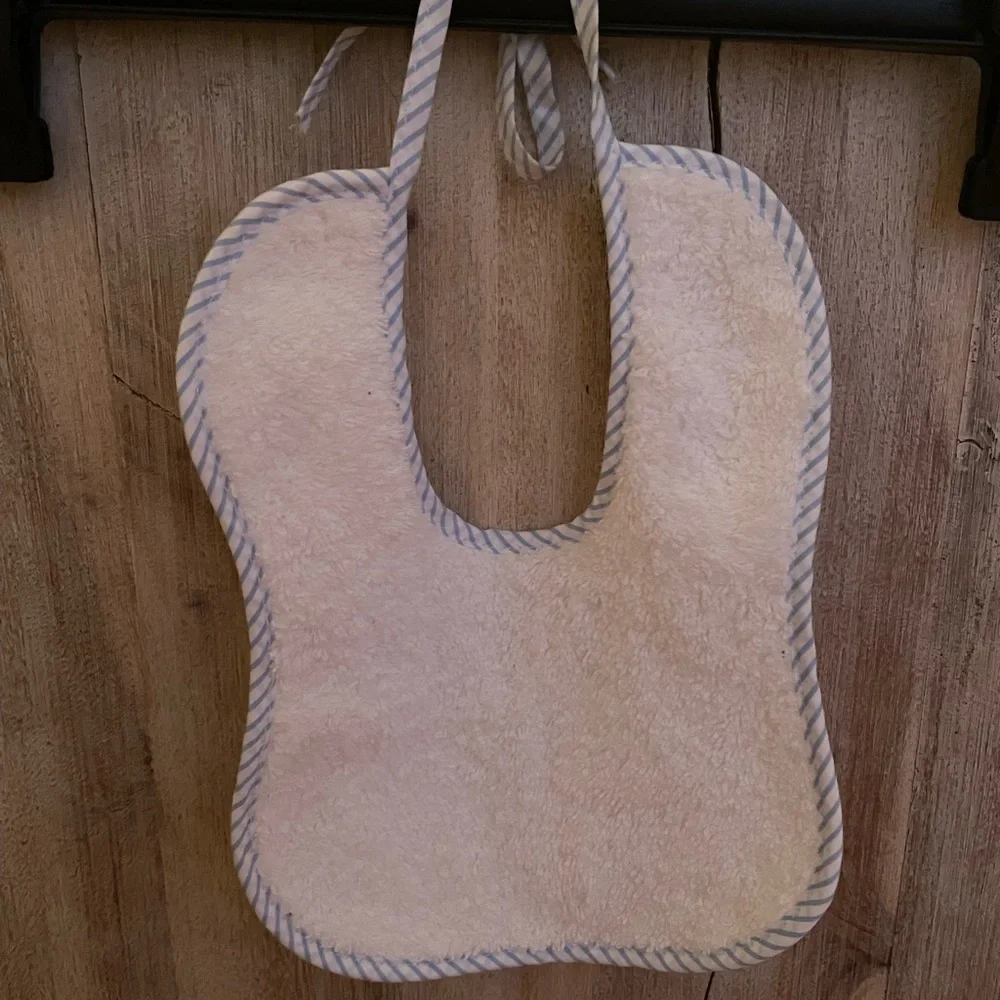 Handmade Bib white with blue trim, tie closure, brand new.